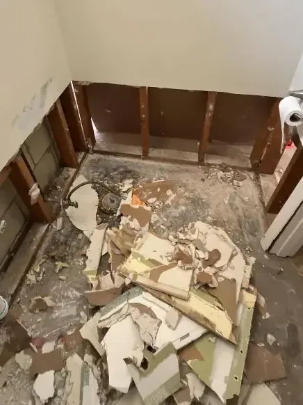 A bathroom taken down to bare studs once sewage cleanup was done
