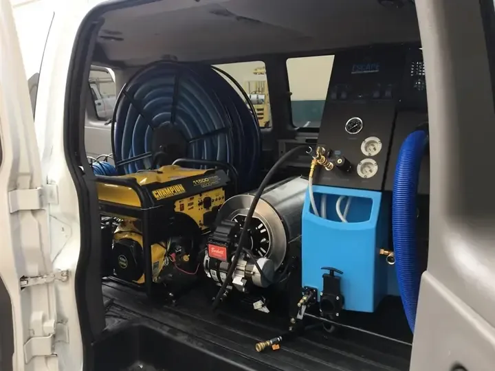Truck-mounted extraction unit and hose reel ready for a water call
